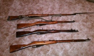 Picture of mosins nagant, two 91/30, M44 with a bayonet and a M38